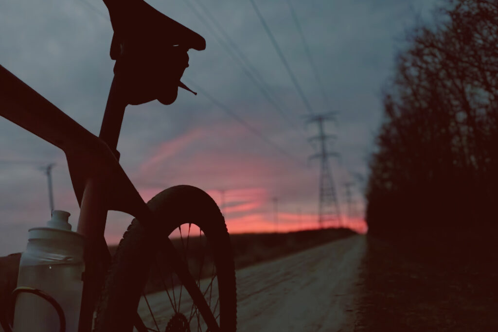 Gravel bike at sunrise during Unbound 200 build phase training
