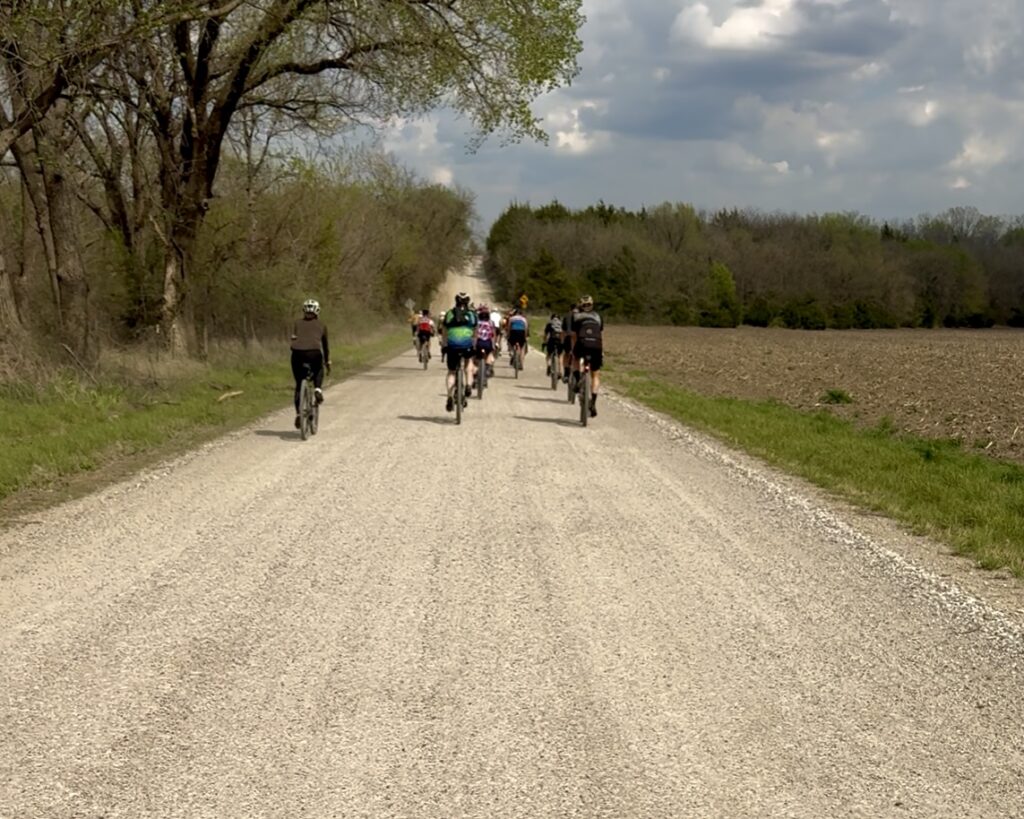 Gravel cyclists navigating the Flint Hills during Unbound Training Camp on a gravel ride in Emporia, Kansas.