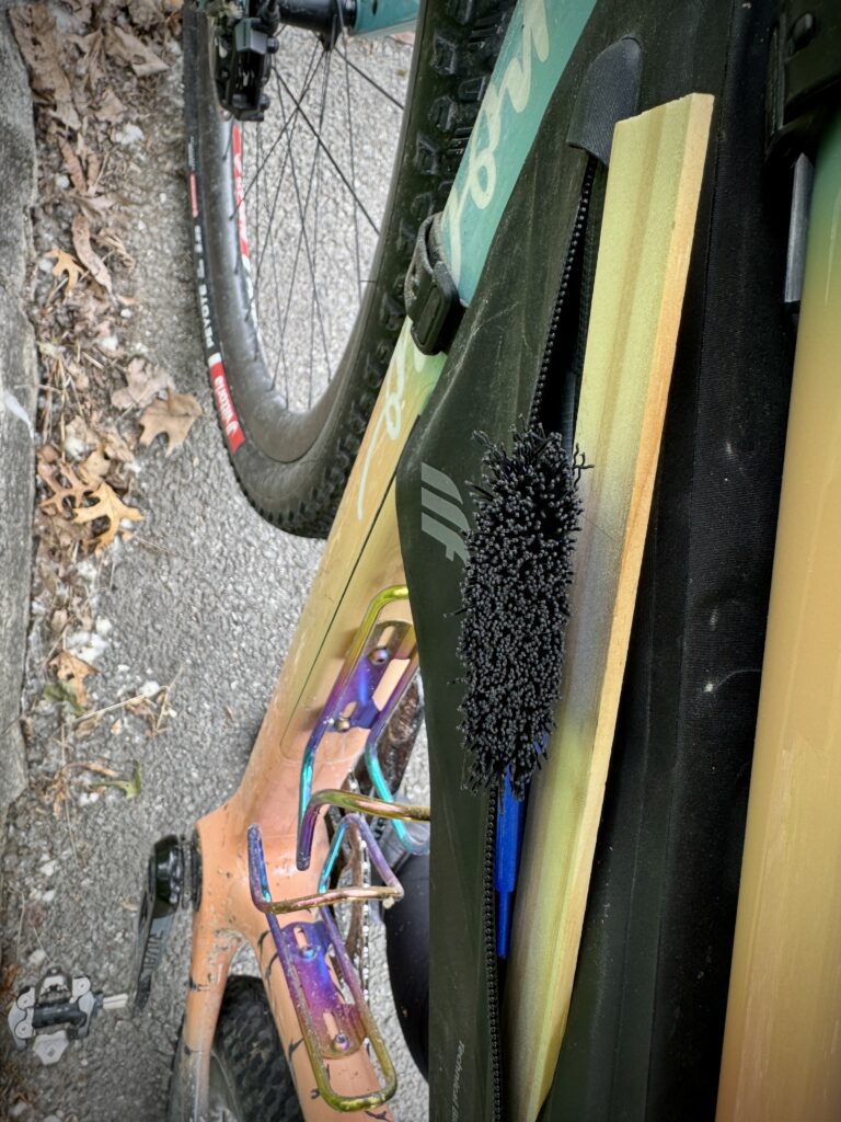 Paint stick for clearing mud from gravel bike drivetrain and tires during wet conditions at Unbound XL in the Kansas Flint Hills