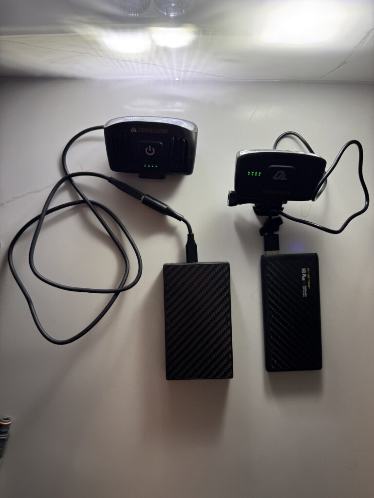 20000mAh and 10000mAh power banks for overnight gravel race lighting and Garmin battery backup at Unbound XL 2026